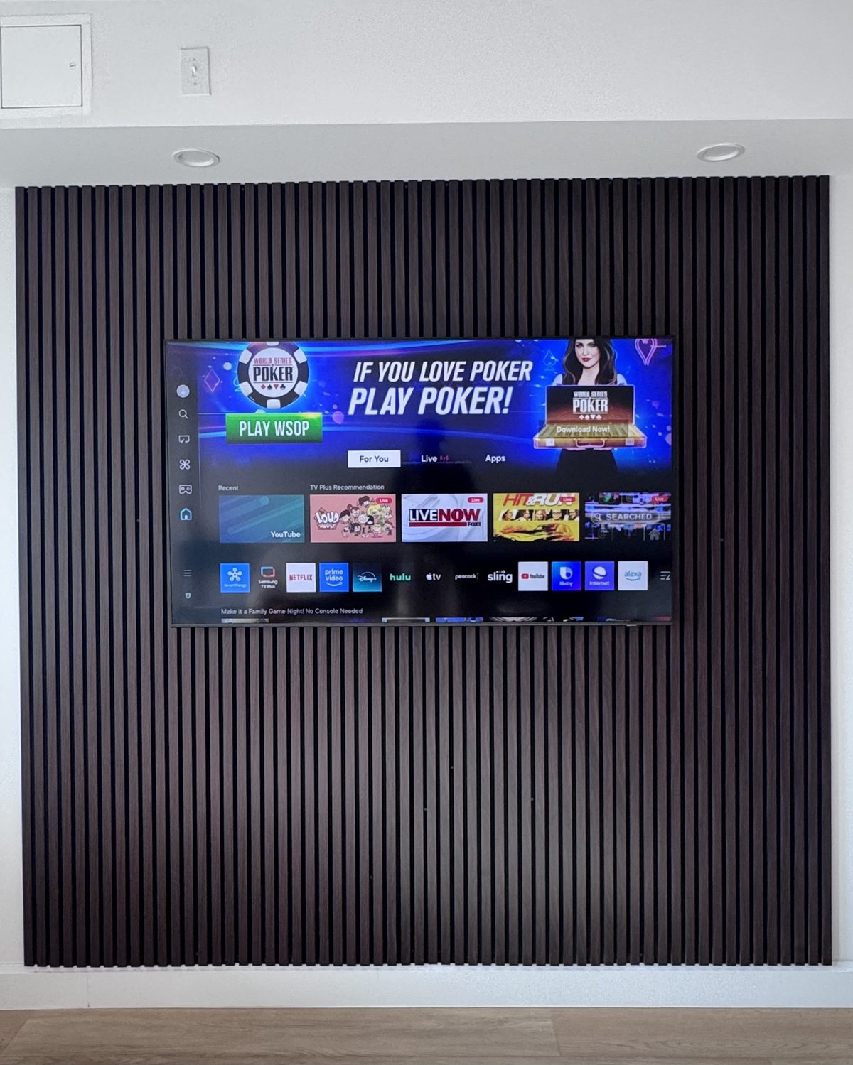 The Aspen, warm walnut slat wall with mounted TV by SEIN ME