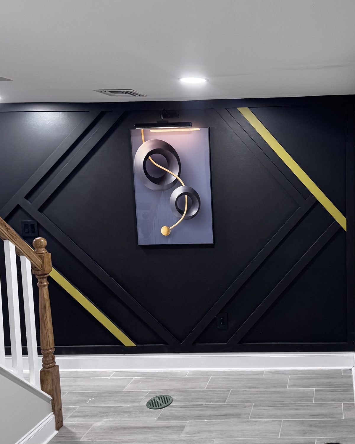 The Foyer, black accent wall with gold diamond geometry by SEIN ME