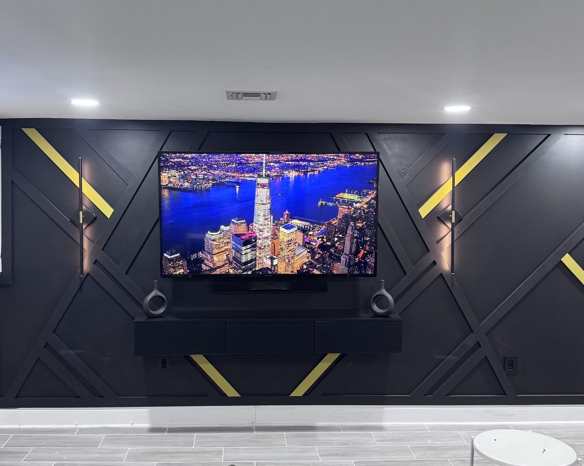 The Onyx, black geometric accent wall with hand-painted gold accents by SEIN ME